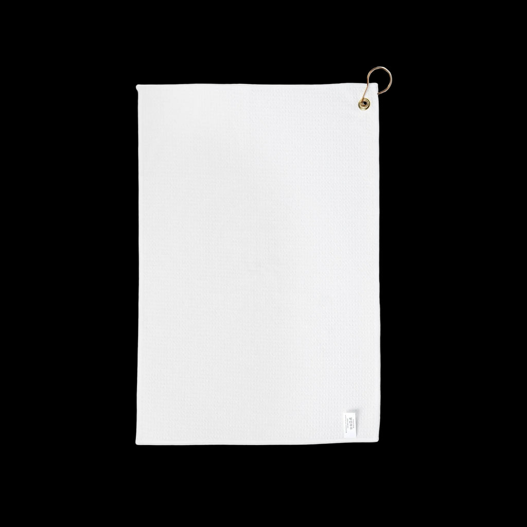 White towel with a gold hook on a white background